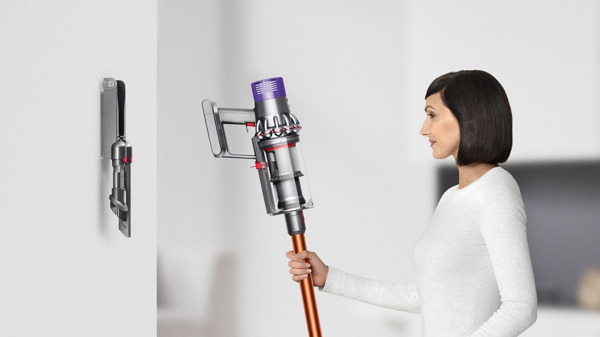 Dyson V10 Absolute cord-free vacuum with docking station, held upright